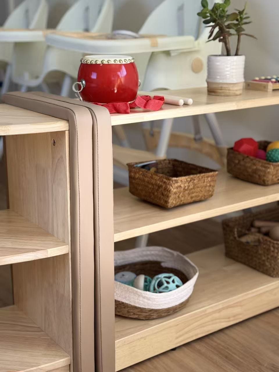 Open shelves designed for ease of reach and sight to facilitate exploration