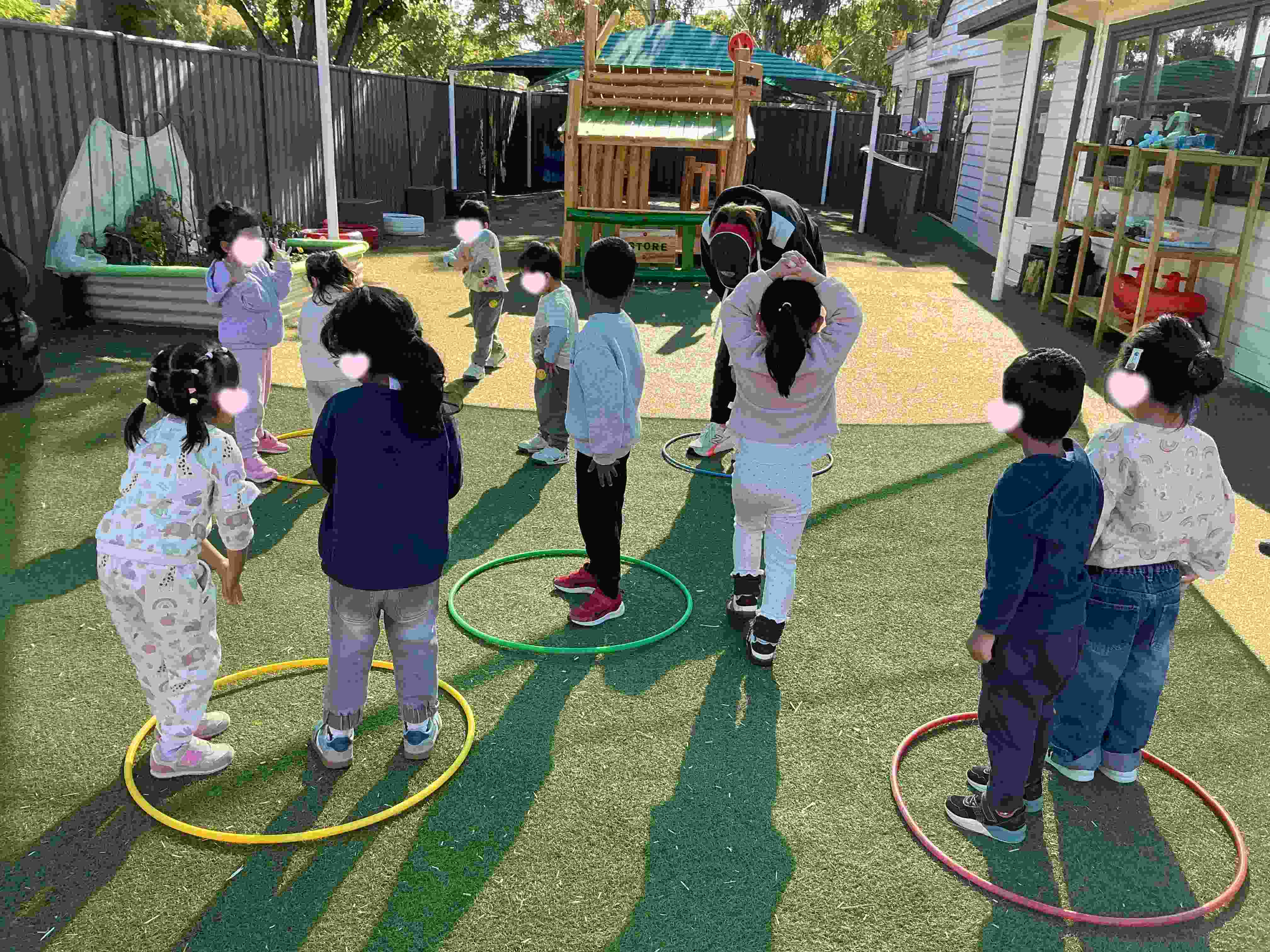 Children participating in a sports program using hula hoops